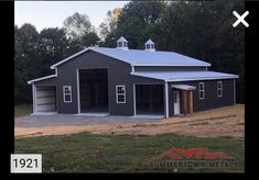 a two car garage in the middle of a field