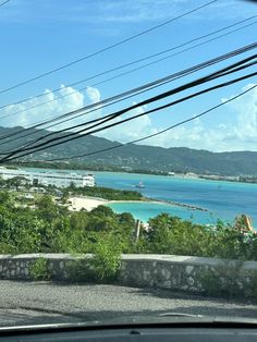 the view from inside a car looking out at an island