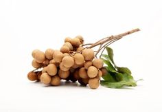 a bunch of nuts and leaves on a white background