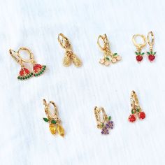 Elevate your style with our delightful fruit earrings, perfect for a Cottagecore outfit.  We have 7 types of fruit charm earrings: gold pineapple earrings, grape earrings, watermelon charm earrings, cute strawberry pendant earrings, cherry earrings, mango earrings, and apple earrings. These botanical earrings make for a thoughtful plant lover gift. These hoops are not only a fashionable accessory but also a unique and thoughtful gift for a daughter or anyone with a green thumb--a perfect present Trendy 14k Gold Filled Dangle Jewelry, Summer Jewelry For Pierced Ears As A Gift, Summer Gift Jewelry For Pierced Ears, Hypoallergenic Dangle Jewelry For Summer, Summer Hypoallergenic Dangle Jewelry, Hypoallergenic Dangle Jewelry, Cute Gold Summer Jewelry, Cute Single Dangle Earring, Trendy Huggie Jewelry Gift