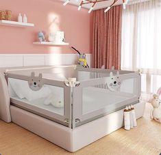 a baby's room with pink walls and white furniture, including a crib