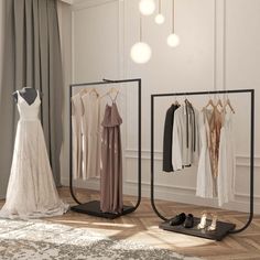 a room with clothes and shoes hanging on the wall next to two mirrors that are displaying wedding gowns