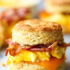 an egg and bacon biscuit sandwich is shown