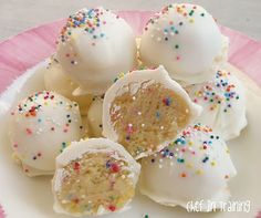 white chocolate truffles with sprinkles on a pink and white plate