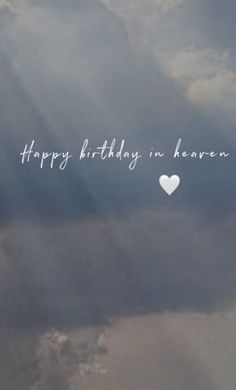 an airplane flying in the sky with a heart on it's side that says happy birthday in heaven