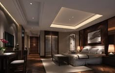 a bedroom with wood flooring and white bedding in the center is lit by recessed lighting