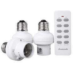 two white light bulbs with remote controls next to each other on a white background,