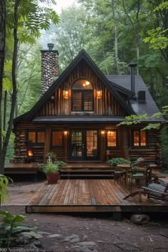 a cabin in the woods is lit up at night