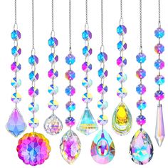 a bunch of different colored jewels hanging from chains