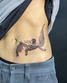 a woman with a tattoo on her stomach