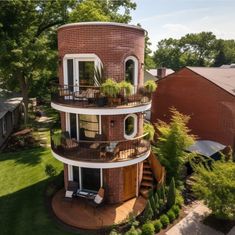 an aerial view of a two story brick building with balconies on the second floor