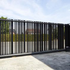 a black fence with metal bars on it