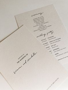 two wedding programs are laying on top of each other, with the wording in cursive writing