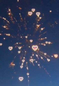 the sky is filled with lots of heart shaped balloons