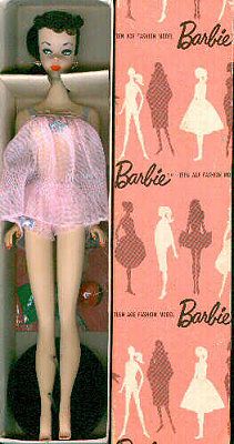 a barbie doll in a pink dress with black hair