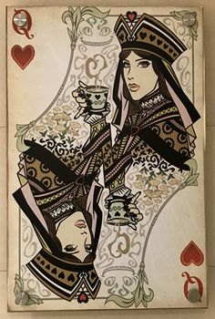 an ace playing card with two women dressed in black and gold, on a white background