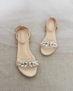 Classy satin flat sandals with butterfly brooch and ankle strap. Effortless yet adorable to wear on your favorite occassion. Can be pair with dress or casual look. DETAILS: COLORS AVAILABLE: Ivory, White, Pink, Light Blue, and Champagne UPPER: Synthetic upper and lining MATERIALS: Mandmade outsole Fall Wedding Shoes, Kids Heels, Girls Flats, Bridal Sandals, Wedding Flats, Bridesmaid Shoes, Wedding Sandals, Rhinestone Bow, Womens Wedding Shoes