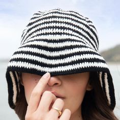 Crochet handmade bucket hat One hat, styled 3 different ways Folds flat in your suitcase Soft crochet, comfortable and easy to wear Handmade in Colombia Classic black and white stripes Each hat is 100% handmade in Colombia and unique in it's own way. Colors and patterns may vary slightly from photo. Soraya’s Note: Carefully handcrafted by artisans in Colombia, we are thrilled to share our brand new handmade crochet bucket hats. With a relaxed and comfortable design, our bucket hats can be styled Soft Crochet, Crochet Bucket, Bucket Hat Black, Crochet Bucket Hat, 90s Looks, Comfortable Design, Black And White Stripes, Crochet Handmade, Bucket Hats