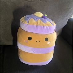 a stuffed toy sitting on top of a couch