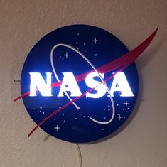 a nasa sign hanging from the side of a wall