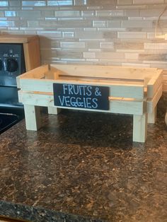 a wooden crate sitting on top of a kitchen counter