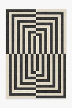 a black and white rug with squares in the middle