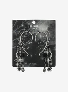 Bring those witchy vibes to your outfit with the perfect accessories! These mystical ear cuffs feature cascading chains with celestial  skull and rose charms  plus clear gem detailing. Celestial Grunge, Space Goth, Witch Inspiration, Cosmic Aura, Spooky Outfits, Future Jewelry, Black Halloween Nails, Bday Wishlist, Skull Accessories