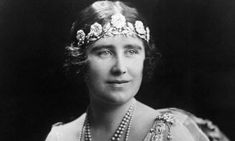 an old black and white photo of a woman with pearls in her hair wearing a tiara