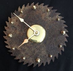 a clock made out of metal with some screws on it