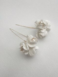 Peoni floral earrings featuring Ivory clay flowers and real freshwater pearls. Matching tiara to complete bridal look: Approx length of the detail is 3cm. Clay flowers, freshwater pearls, Silver/Gold plated jewellery wire. This design can be customised (contact us for more info). As each of our pieces is handmade especially for you, we are unable to accept returns/exchanges (please contact us for more info). Handmade Flower Shaped Pearl Wedding Earrings, Pearl Drop Flower-shaped Bridal Earrings, Elegant Bridal Flower-shaped Pearl Drop Earrings, Pearl White Flower-shaped Pearl Earrings For Wedding, Pearl White Flower-shaped Wedding Earrings, Flower Pearl Earrings, Clay Flower Earrings, Jewellery Wire, Making Fabric Flowers