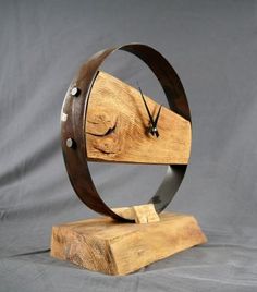 a clock made out of wood and metal