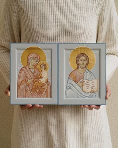 two framed images of the virgin mary and jesus holding a small child in their lap