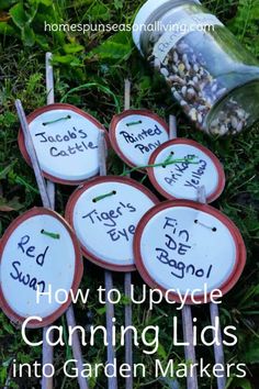 garden markers with the words how to upcycle canning lids into garden markers on them