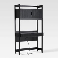 a black shelf with an electrical outlet in the middle and two shelves on each side