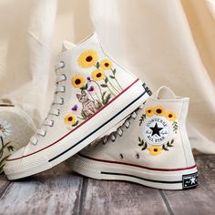 Custom Embroidered Converse High Tops 1970s, Sunflower Embroidered Shoes Custom, Cat and Gardens Sunflower Embroidered Converse, Gift for Women 💚 Immerse yourself in the intricate craftsmanship as we lovingly hand embroider rustic flowers onto your chosen Converse pair 💚 🌿 The listed price encompasses both the Converse Shoes and the showcased Embroidery Designs. 1. MANUFACTURING PROCEDURE 🌿 Upon receiving your order, we initiate the shoe preparation process. If your chosen shoes are readily Cheap Yellow Embroider Shoes, Converse Platform Sunflower, Converse Shoes Sunflower, Converse Shoes Sun Set Swirl Taylo, Sunflower Converse, Converse Sunflower, Gemma Core, Embroidered Converse High Tops, Embroidered Snake