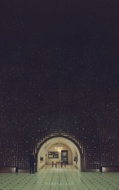 the inside of a building with tiled flooring and walls in black and white colors