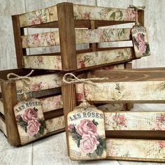 four wooden boxes with roses painted on them