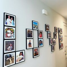 a wall with many pictures hanging on it