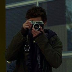 a man taking a photo with his camera