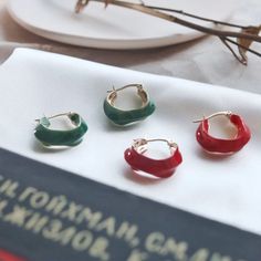 [MATERIAL]: Brass with enamel. [HOOP SIZE]: 20mm or 0.78" Red Enamel Hoop Earrings Gift, Red Enamel Hoop Earrings For Gifts, Small Hoop Red Earrings For Everyday, Trendy Red Metal Hoop Earrings, Green Enamel Hoop Jewelry, Trendy Small Hoop Red Earrings, Retro Enamel Earrings As Gift, Trendy Red Hoop Earrings, Trendy Small Red Hoop Earrings