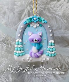 a blue and white ornament with a koala bear on it's back