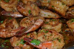 cooked shrimp with herbs and seasoning in a pan