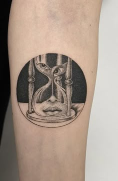 an hourglass tattoo on the right thigh