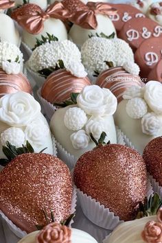 chocolate covered strawberries with white and pink decorations