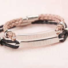 two personalized bracelets with leather cord and silver plated clasps on a white background