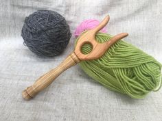 two balls of yarn and a crochet hook