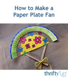 a paper plate fan sitting on top of a table