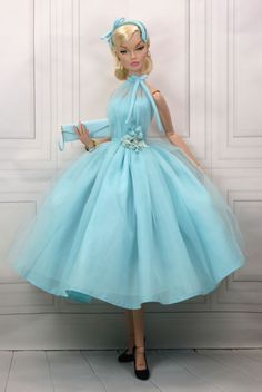 a barbie doll dressed in a blue dress