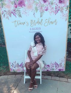 a woman sitting on a white chair in front of a large sign that says, tutu's bridal show