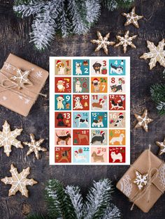 a christmas card with pictures of dogs and snowflakes on it, surrounded by presents